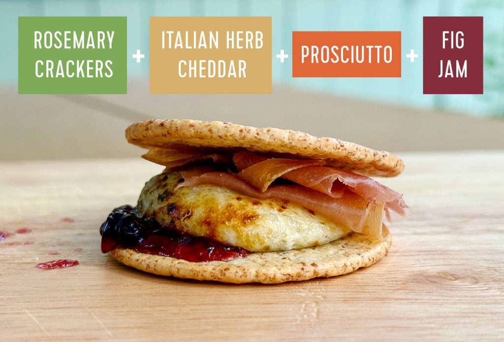 Upgraded Savory Smores With Rosemary Cracker Italian Herb Cheddar Proscuitto and Fig Jam