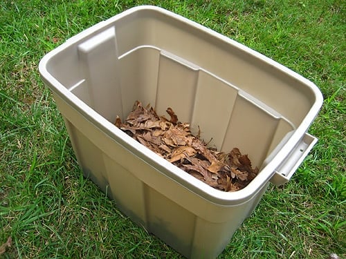 compoststep3 dried leaves in bottom of homemade compost bin