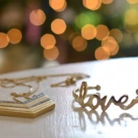 Maternity Portraits In Front Of The Christmas Tree