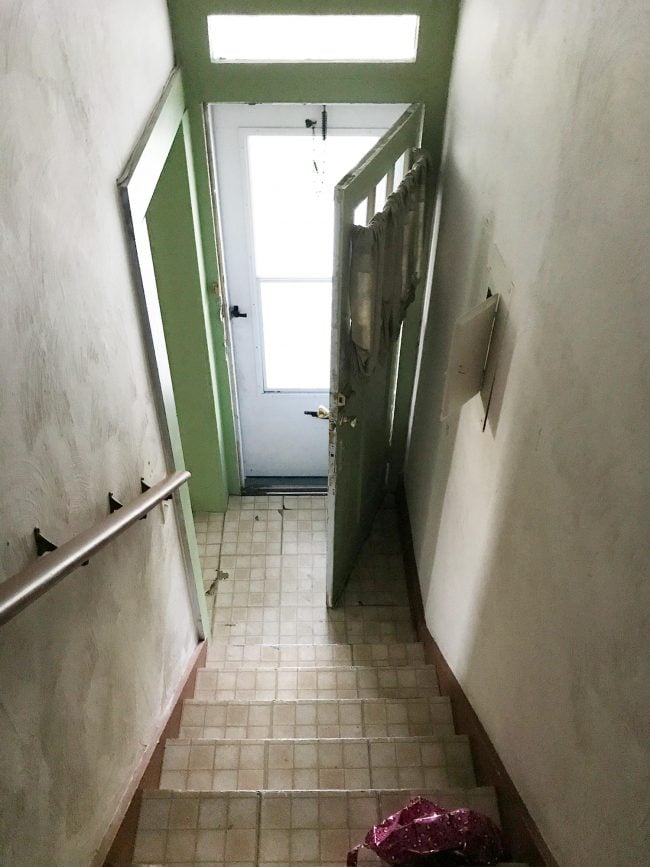 Before photo of stairwell in duplex renovation