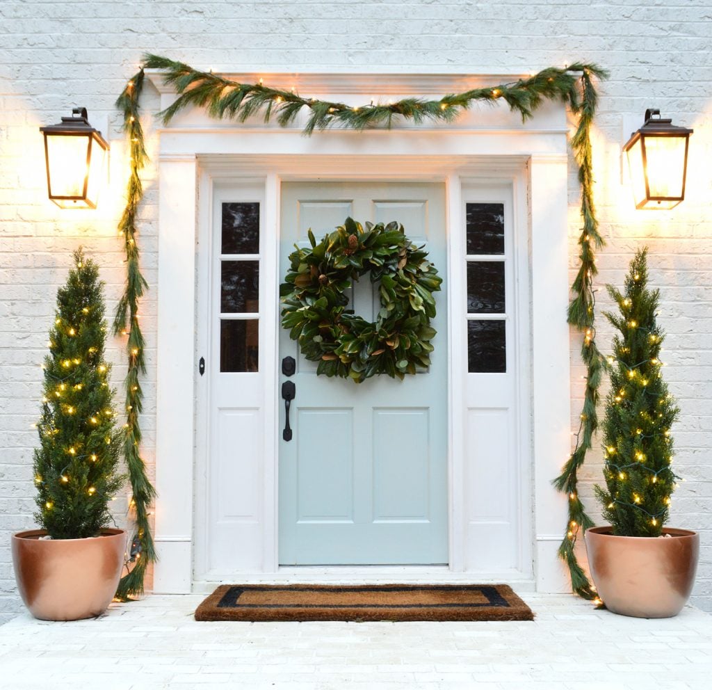 Glossy front door with christmas decorations tranquility benjamin moore