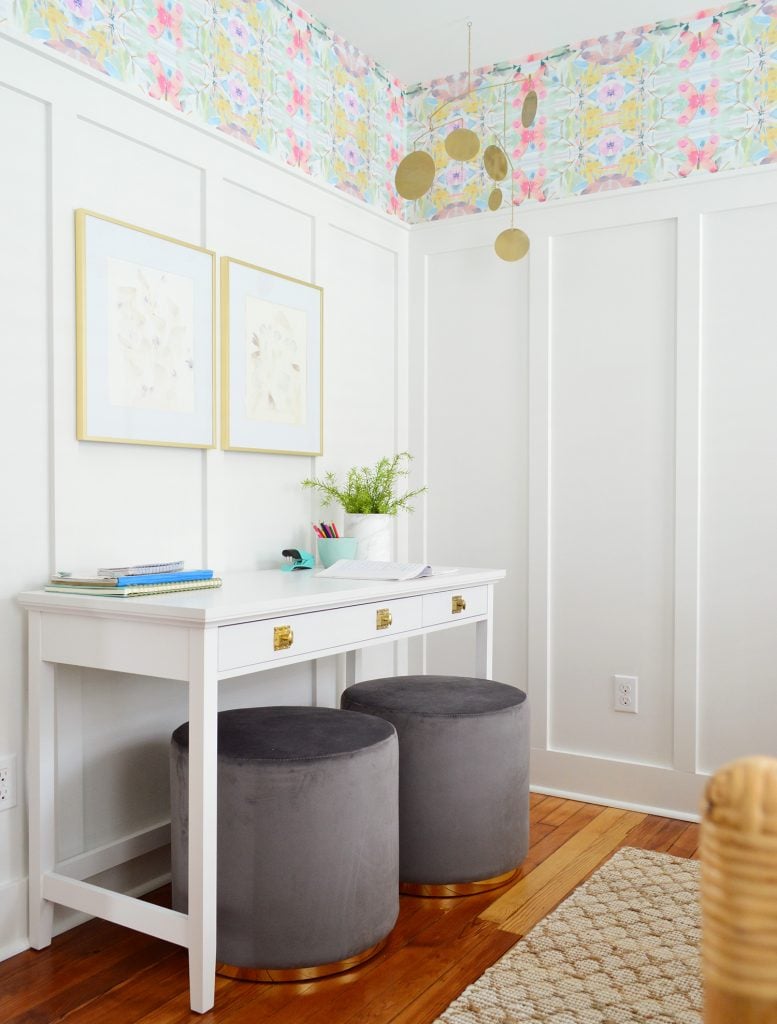 White Writing Desk Against White Board And Batten With Pouf Ottoman Seats