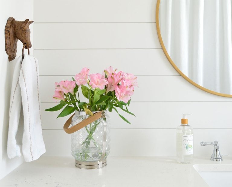 Shiplap Wall In Bathroom Painted Extra White With Round Gold Mirror Flowers