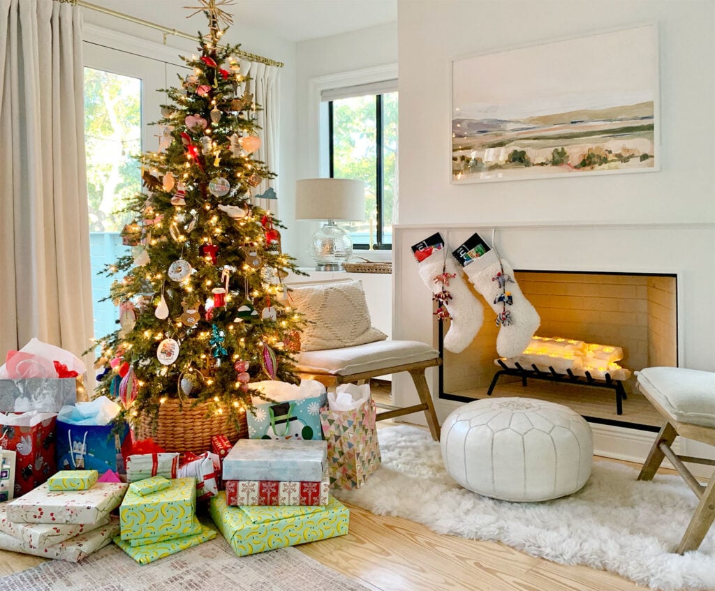 Christmas Tree In Bedroom. Next To Fireplace With Gifts Under